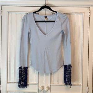 Free People accent sleeve/long sleeve top!